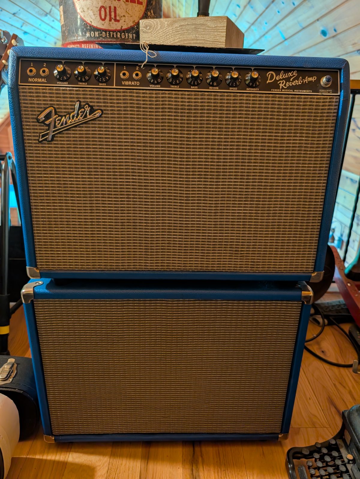 The author's Fender Deluxe Reverb, blue tolex, atop its matching cab
